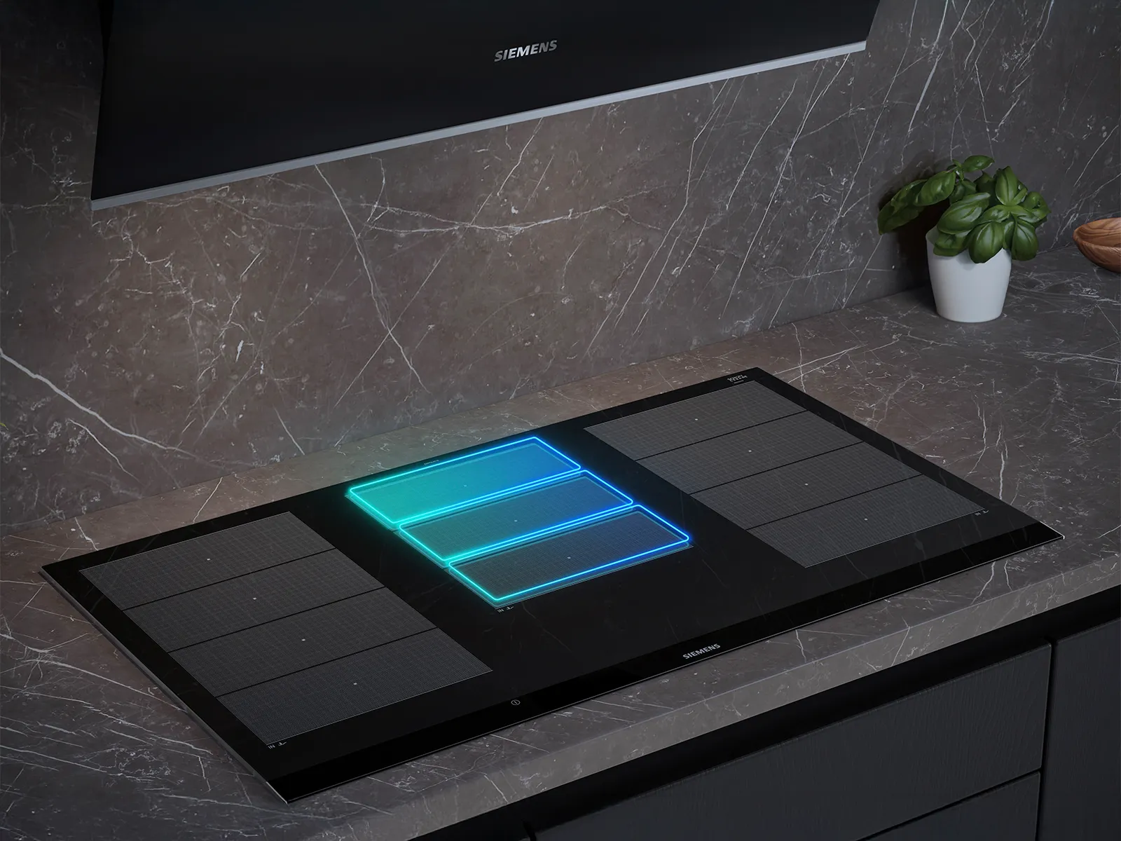 Siemens induktionskogeplade med powerMove Plus, der har tre automatiske varmezoner for problemfri madlavningskontrol.