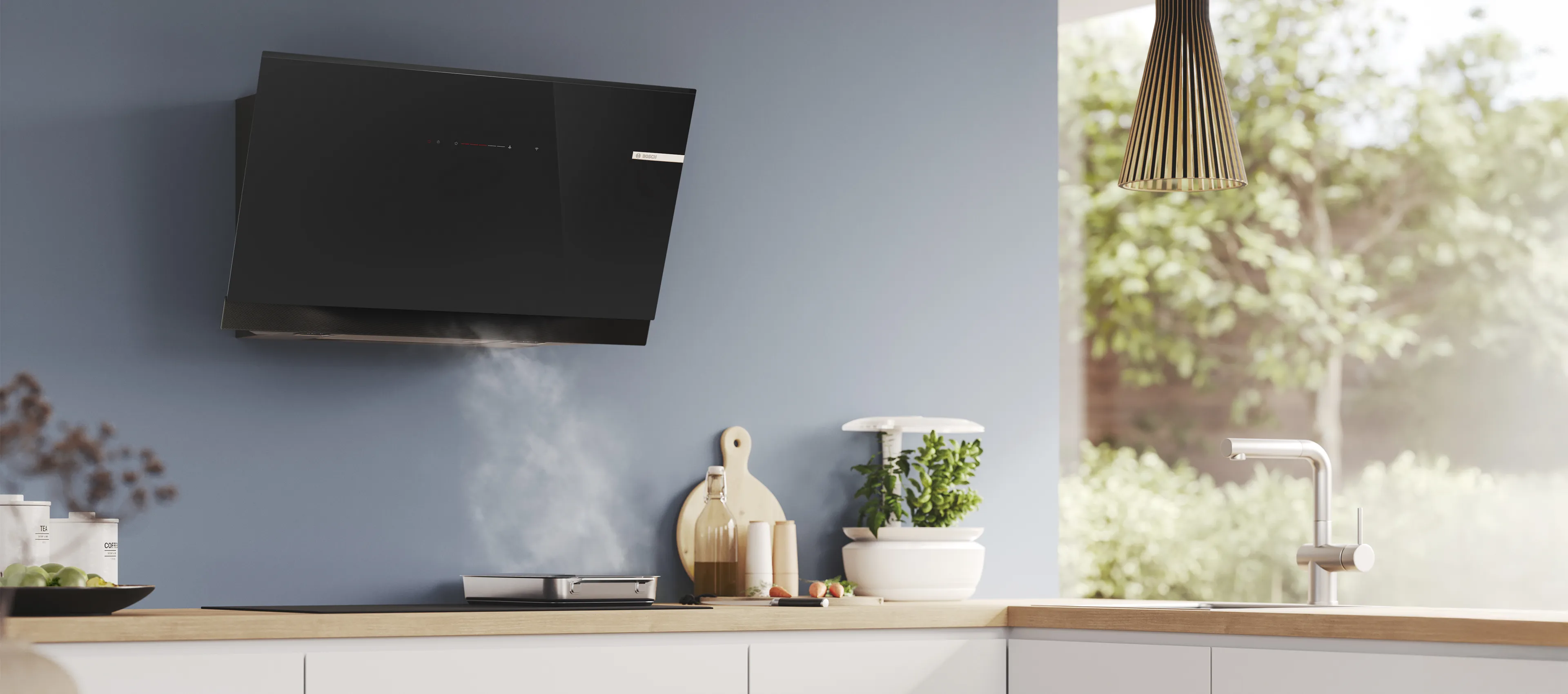 Built in cooker hoods in a white kitchen.