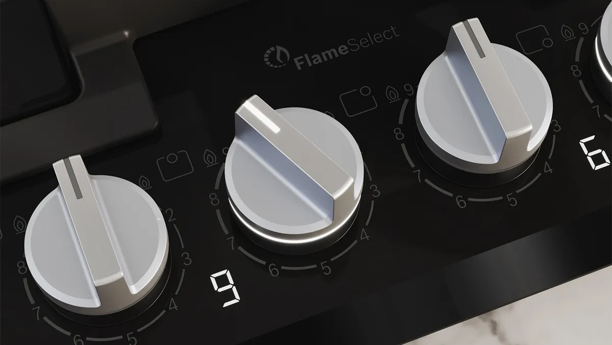 Close-up of a Bosch gas cooktop showing sleek metal control knobs and a modern design on a black surface.