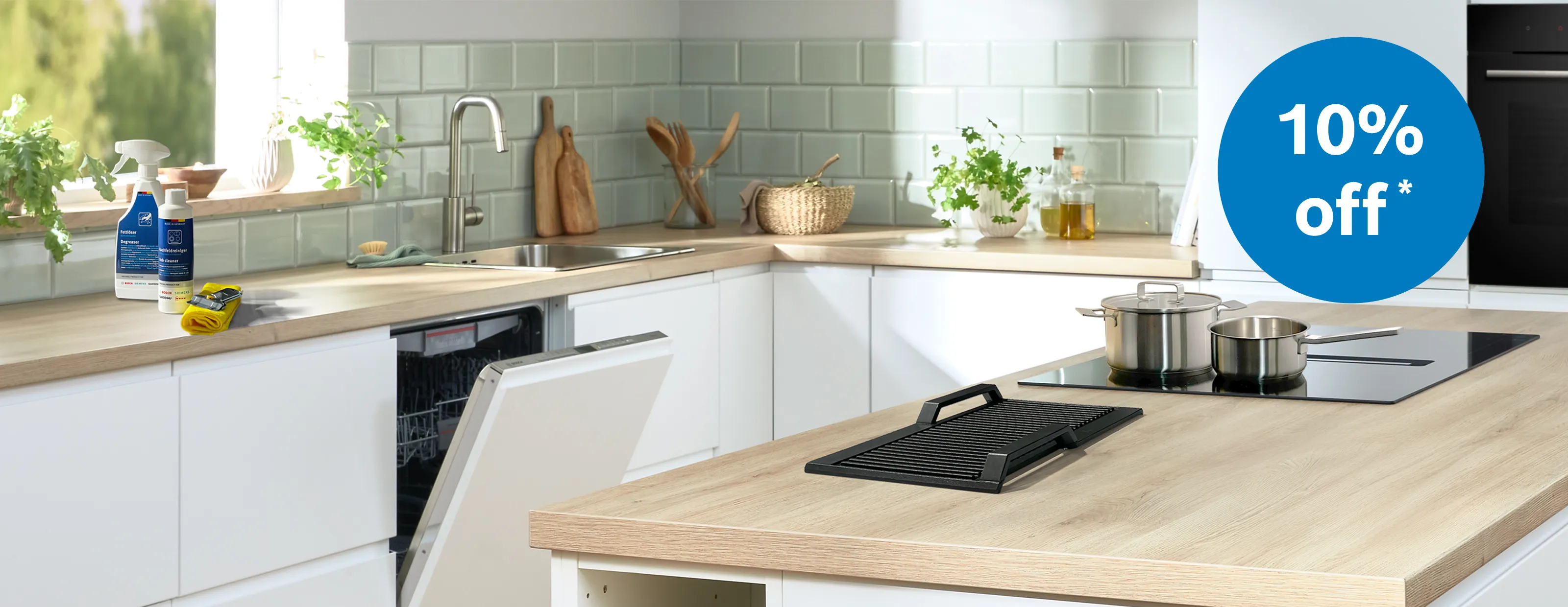 Bosch kitchen with accessories and cleaning products on kitchen counter