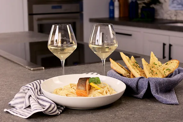Seared salmon with creamy lemon fettucine
