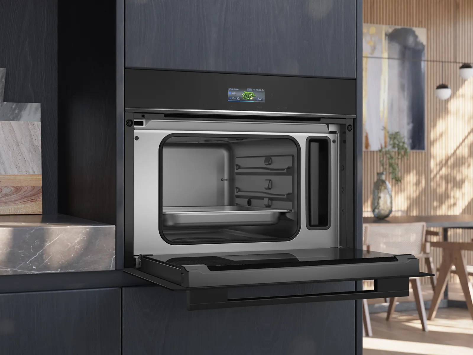 תנור אפייה מובנה אלגנטי עם דלת פתוחה, המציג חלל פנימי מרווח מפלדת אל-חלד, הממוקם בסביבת מטבח מודרנית.