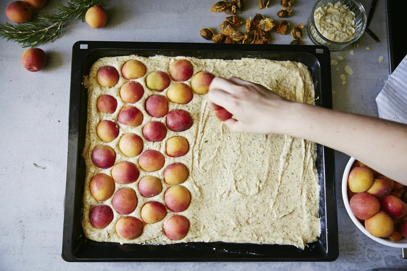 cake mixture with apricots laid out on top
