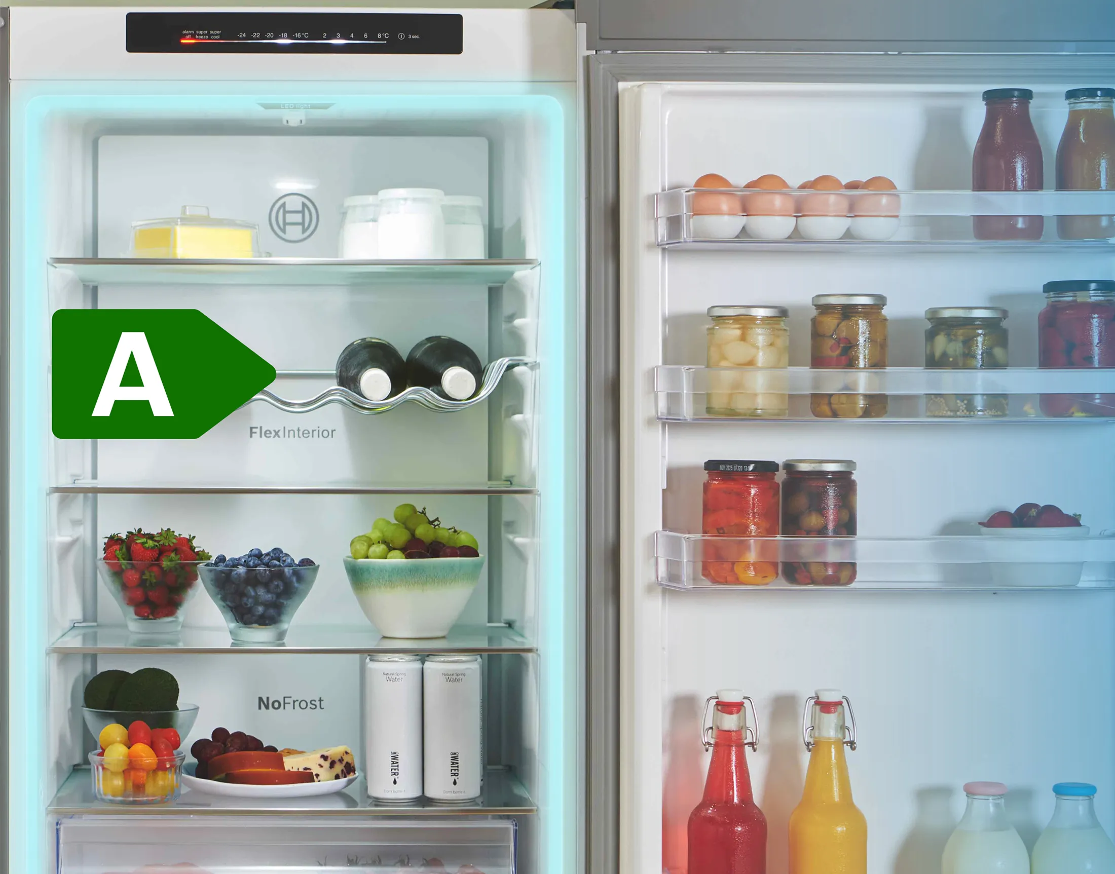 Open fridge freezer, fully stocked with A rated energy use icon