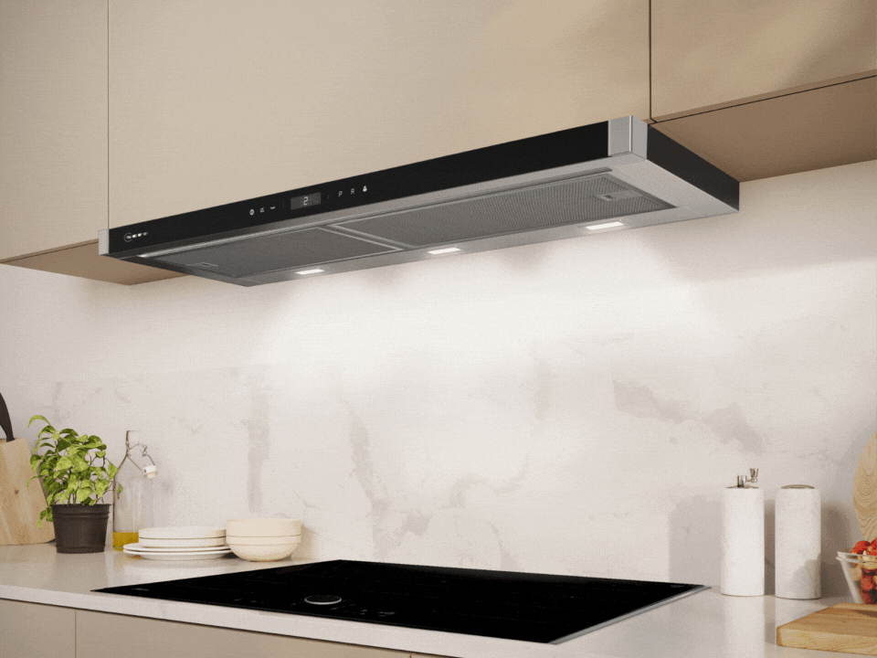 Modern kitchen with an induction cooktop, a sleek black range hood, and beige cabinets