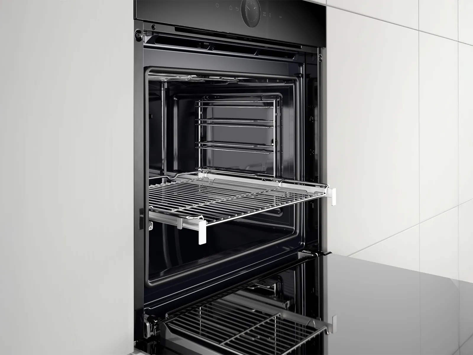 An open black oven showcasing a chrome wire rack and a sleek.