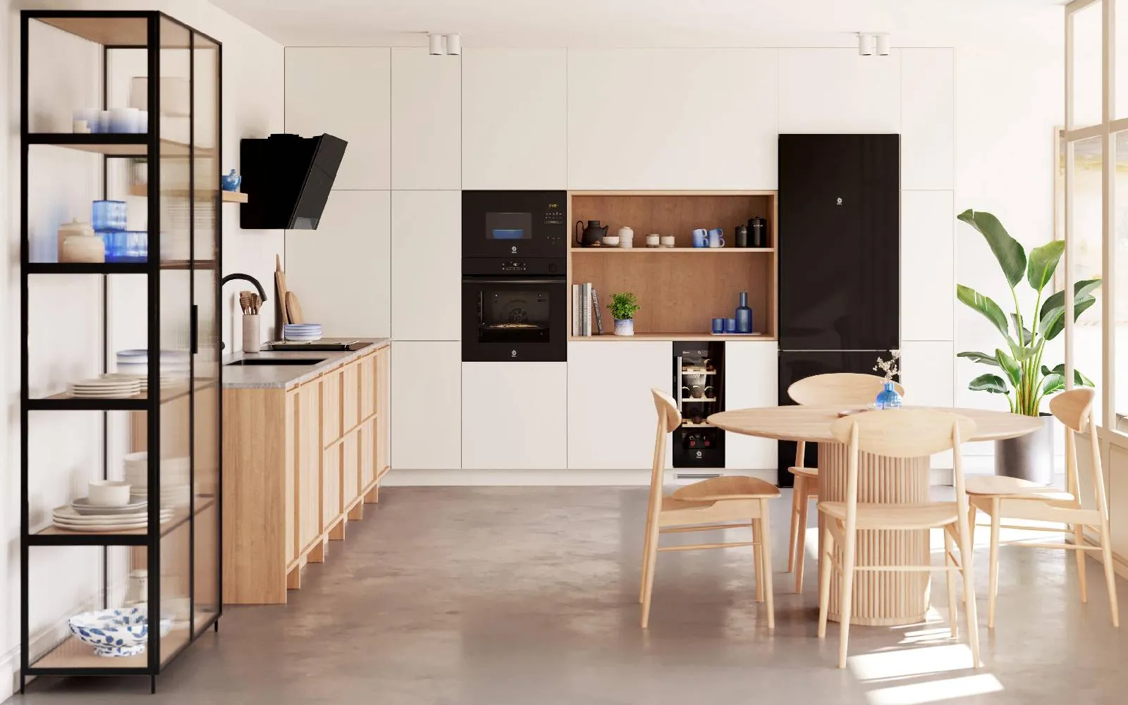 Cocina moderna con armarios de madera clara, muebles integrados blancos, electrodomésticos Serie Cristal negros, una mesa de comedor de madera y sillas.