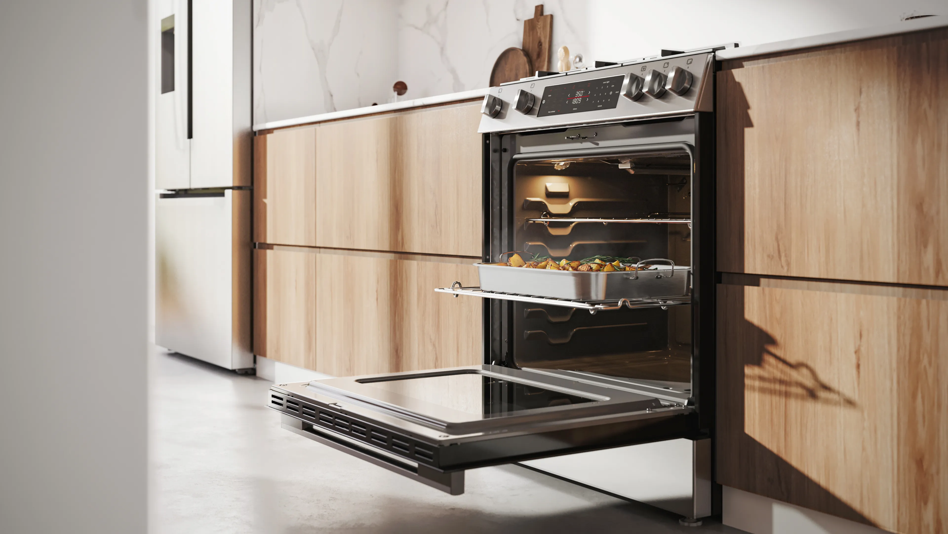 100 series range oven door open with food in metal tray on the bottom rack