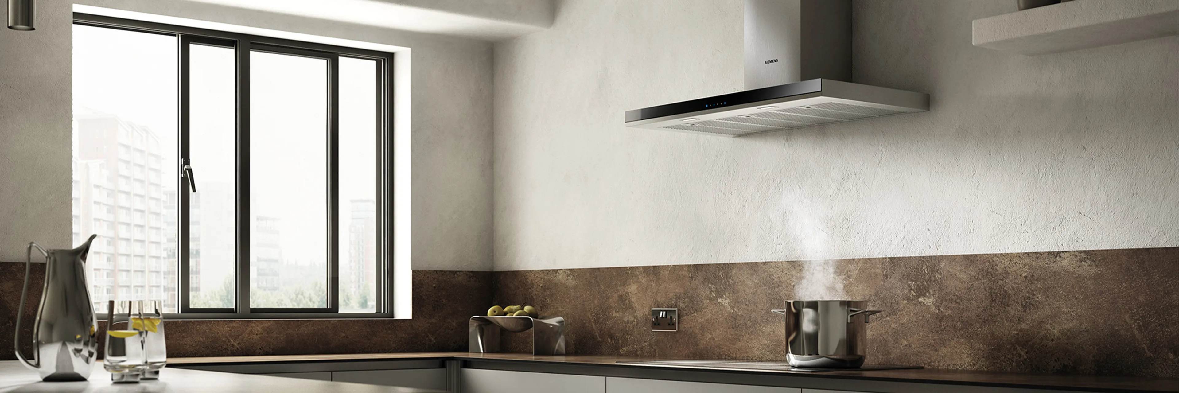 Cooker hood extracting steam in kitchen