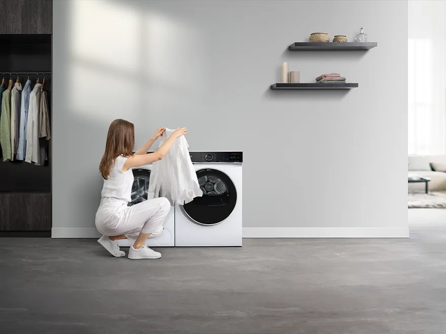 woman removing laundry from the machine