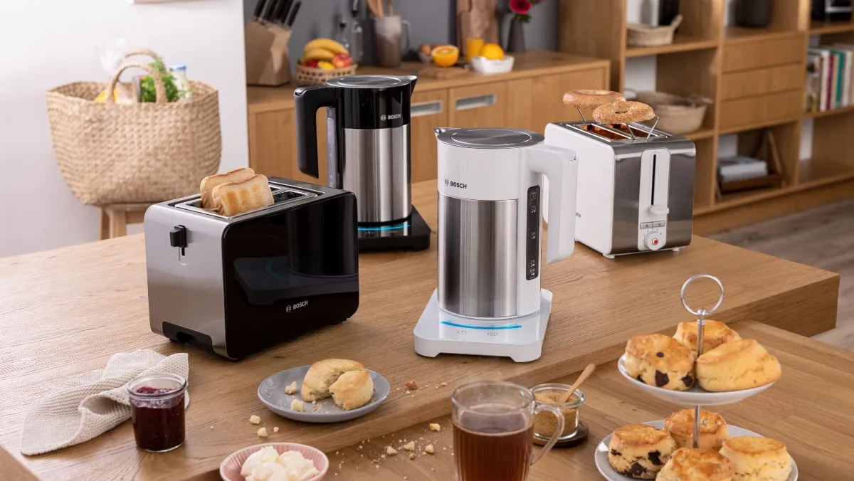 Multiple Bosch kettles and toasters surrounded by food and drink