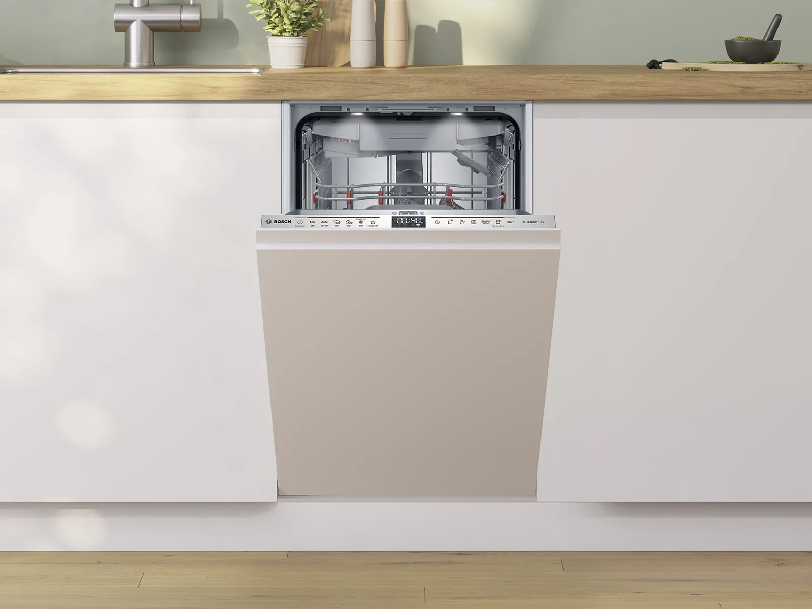 An open Bosch dishwasher in a modern kitchen, showcasing its interior racks and control panel.