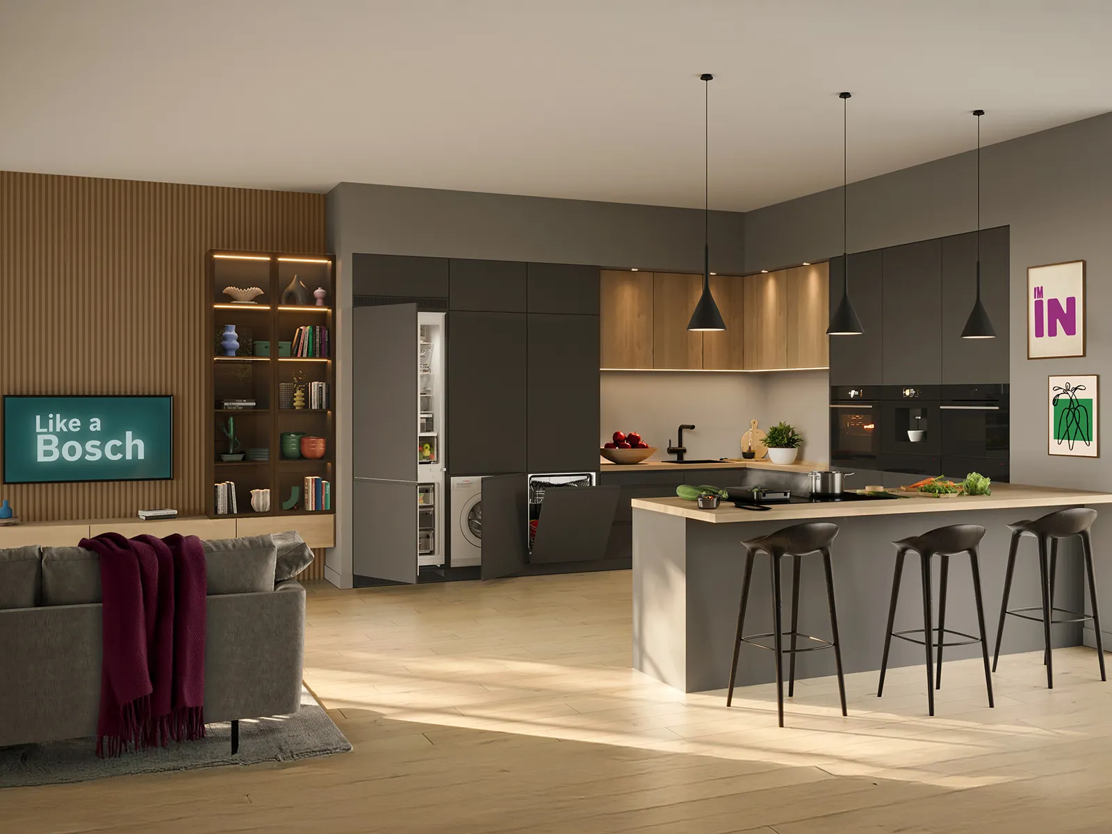 Cocina abierta al salón con televisor encendido y electrodomésticos integrados