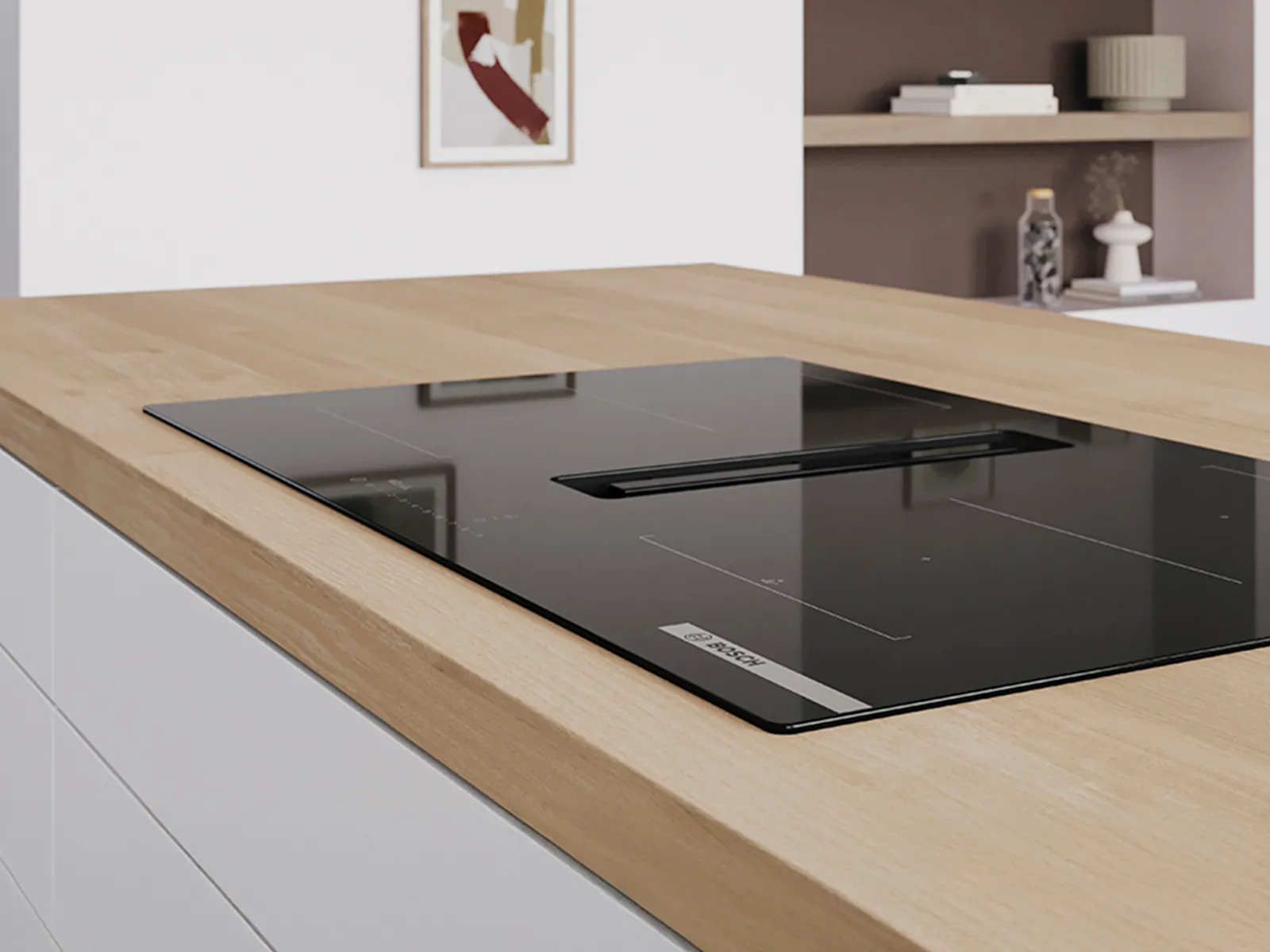 A modern kitchen featuring a black induction cooktop on a light wooden countertop.