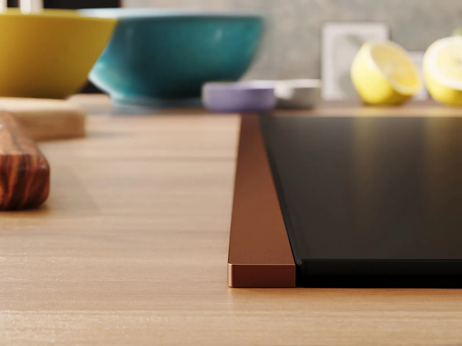 Detailansicht eines NEFF Induktionskochfelds mit Flex Design Seitenleisten in Brushed Bronze