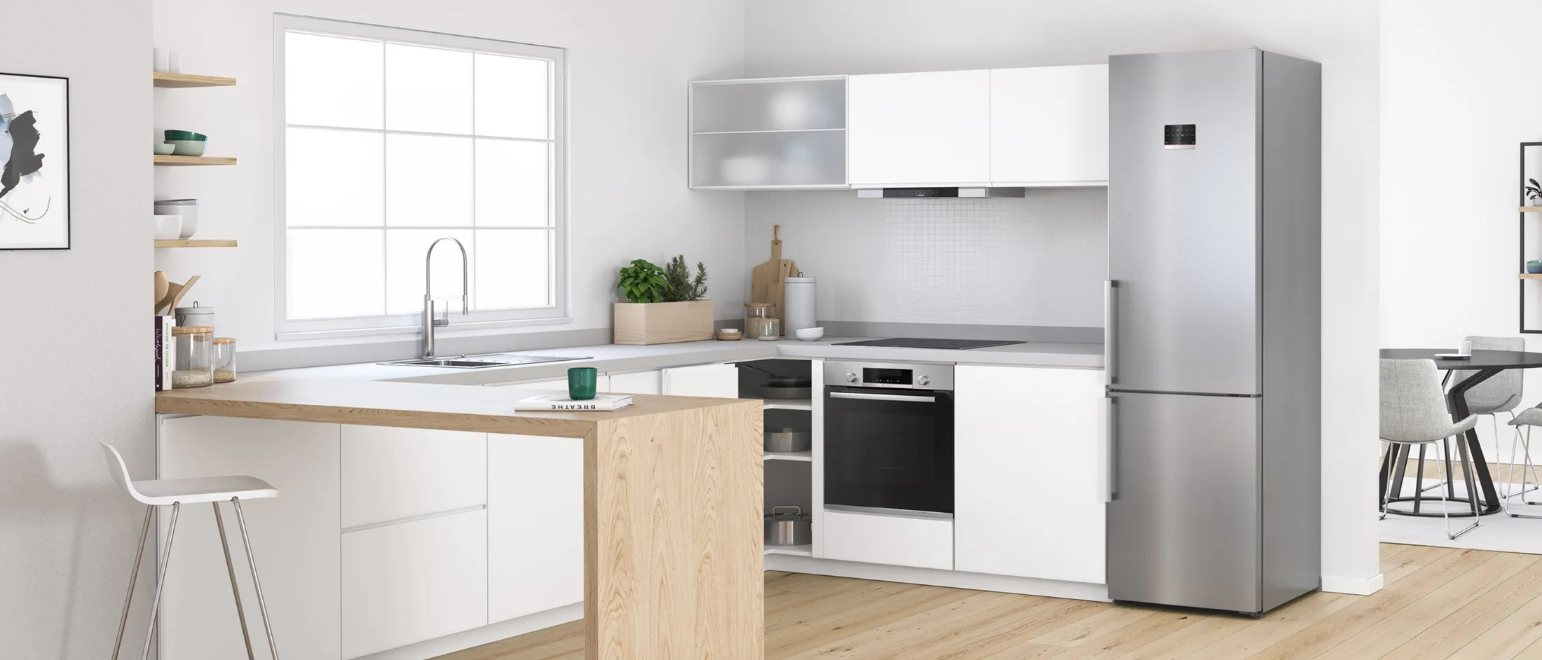Modern kitchen with a stainless steel fridge, white cabinets, wood countertop, and blue wall decor.