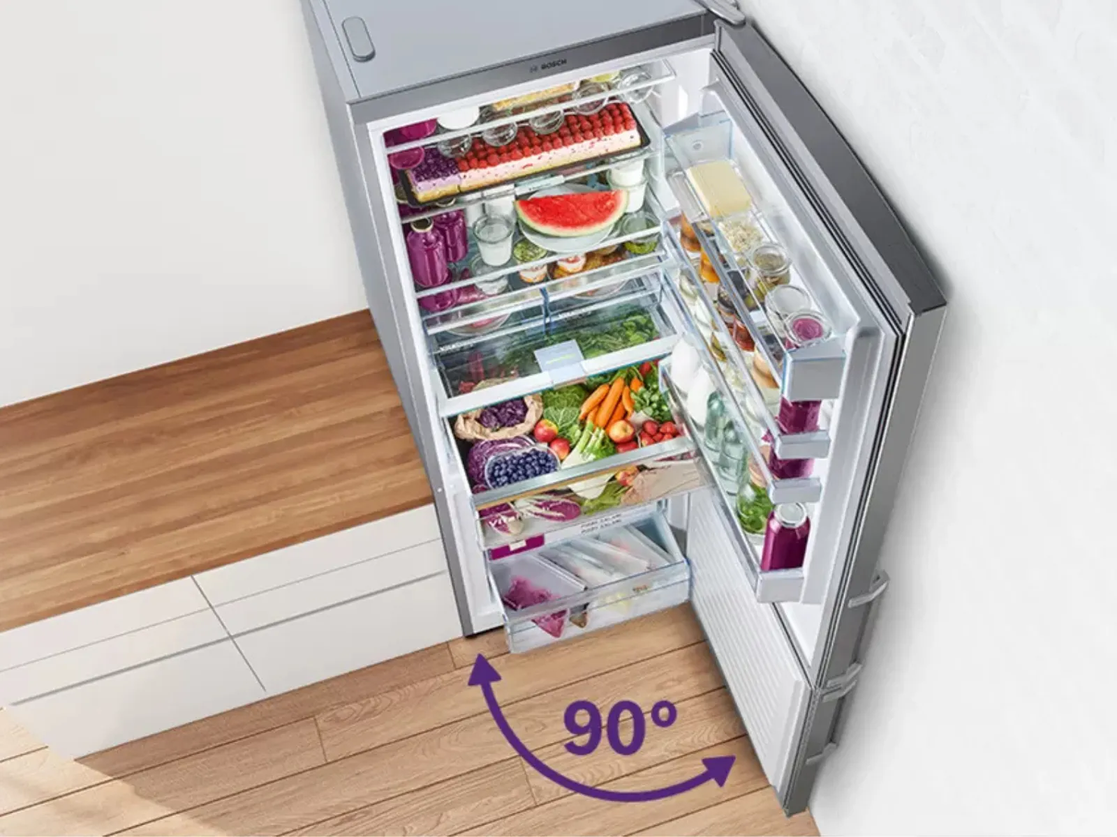 Aerial view of a refrigerator with an open drawer, indicating a 90° angle for easy access.