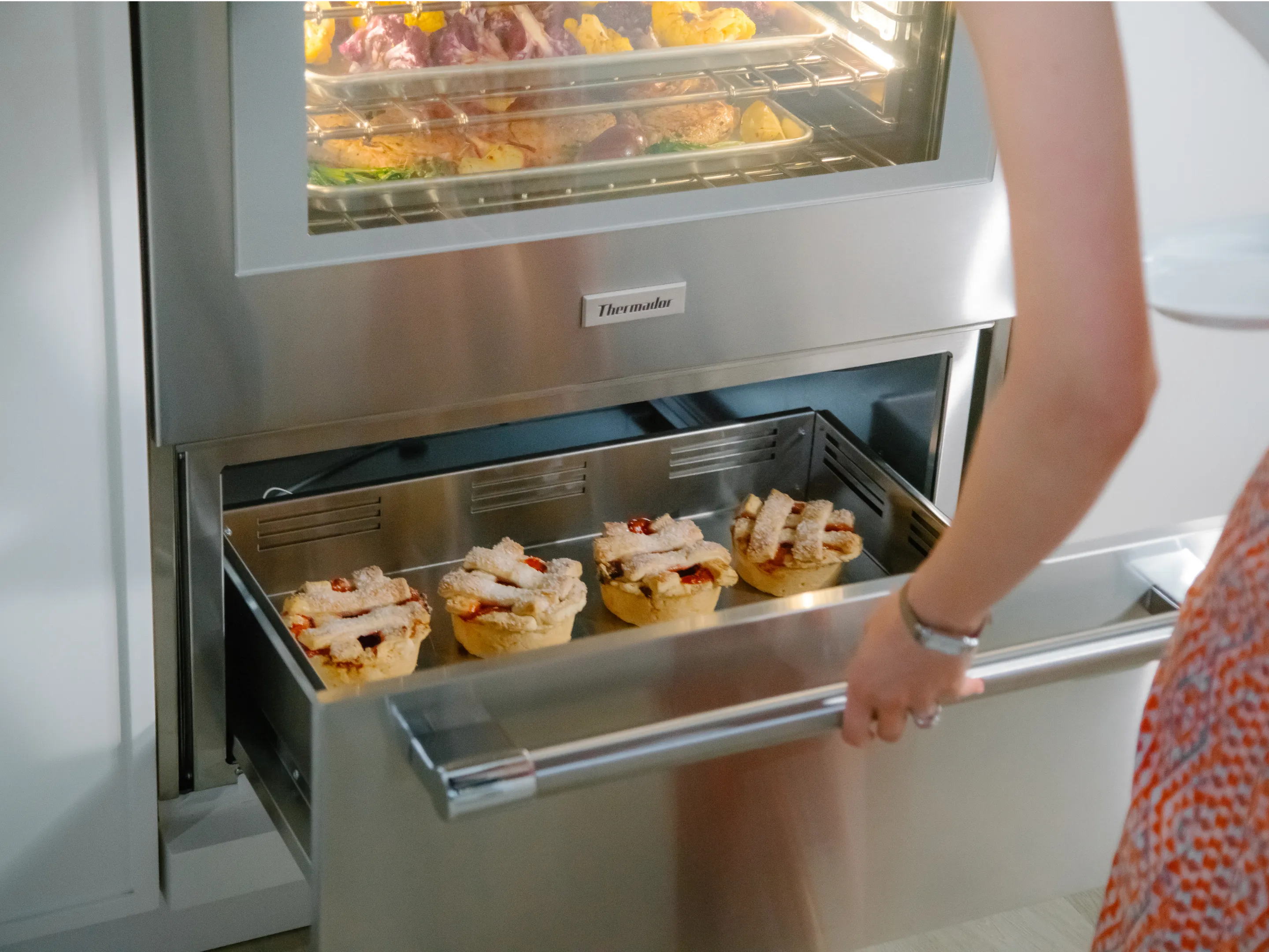 Thermador triple ovens closeup professional warming drawer with pastries