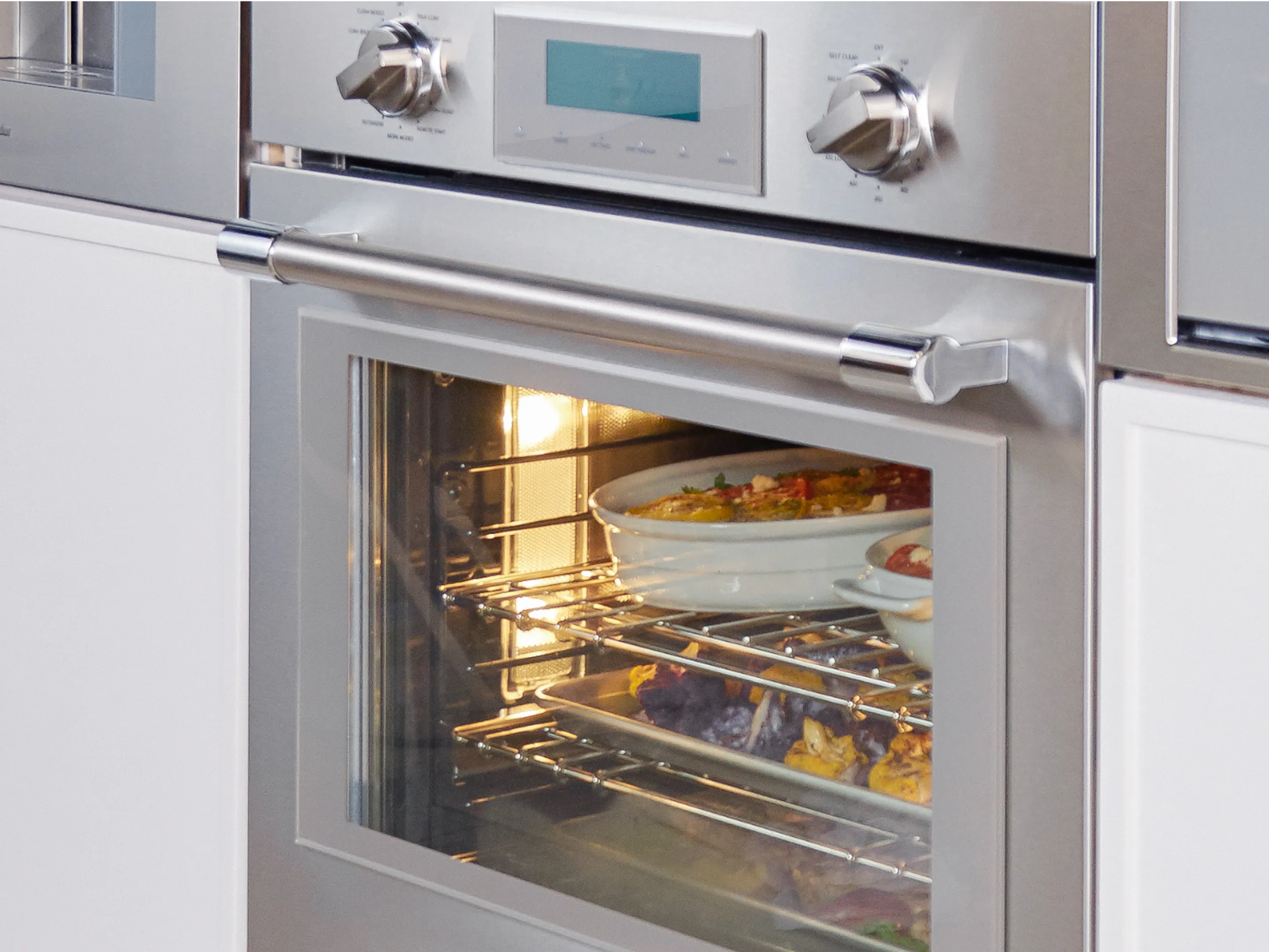 Thermador triple ovens closeup professional oven with food inside