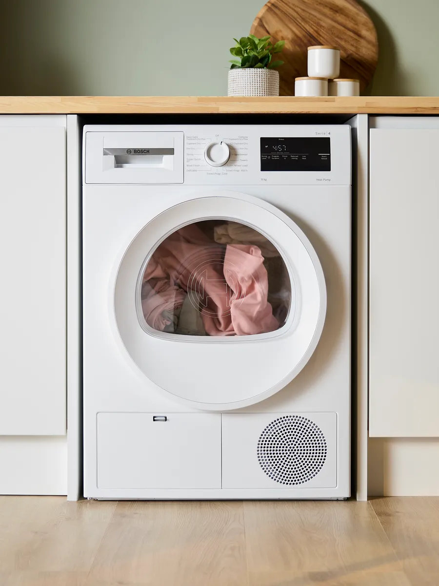 Bosch tumble dryer under a kitchen counter