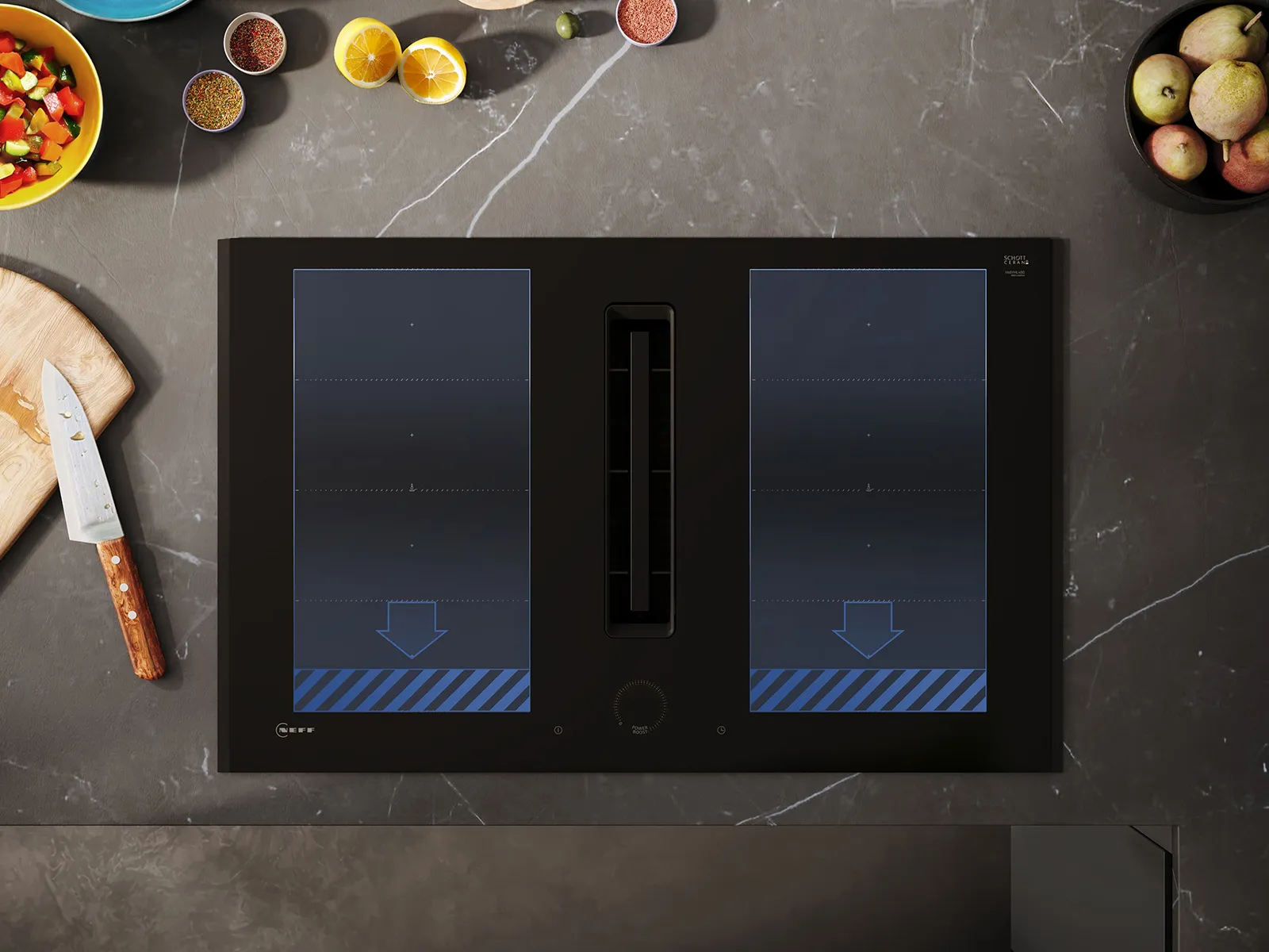 A black induction cooktop with two zones, surrounded by fresh ingredients and a wooden cutting board with a knife.