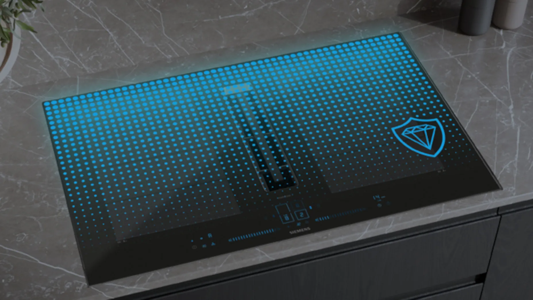 Surface de plaque de cuisson noire avec affichage lumineux pixelisé bleu et symbole de diamant dans le coin droit