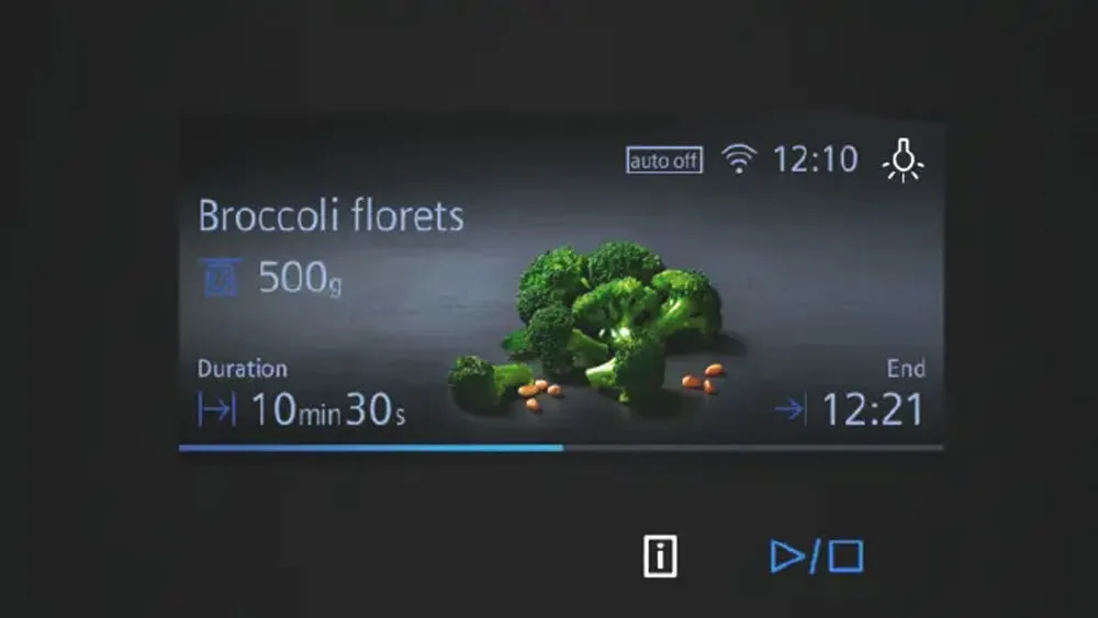 Schermo digitale con timer e immagine di broccoli e carote, testo 'Broccoli florets 500g', durata 10 min 30 s, orario 12:10 e 12:21