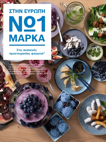 Μια ποικιλία από όμορφα σερβιρισμένα φρούτα και επιδόρπια, όπως πολύχρωμα μούρα και κομψά γλυκά, βρίσκεται πάνω στον πάγκο.