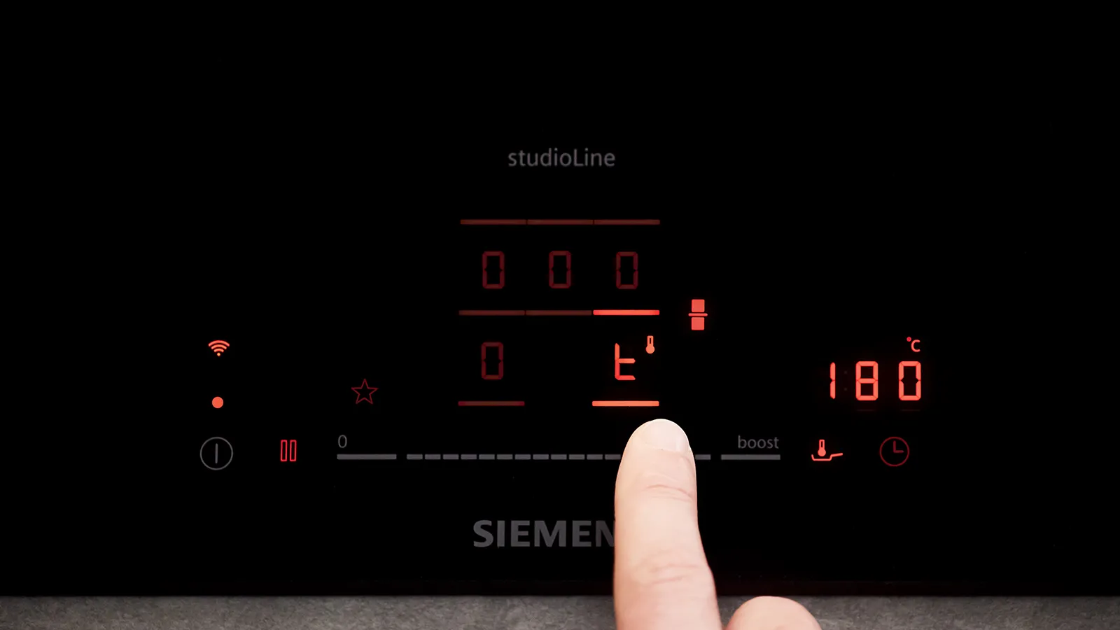 Closeup of person using studioline control panel