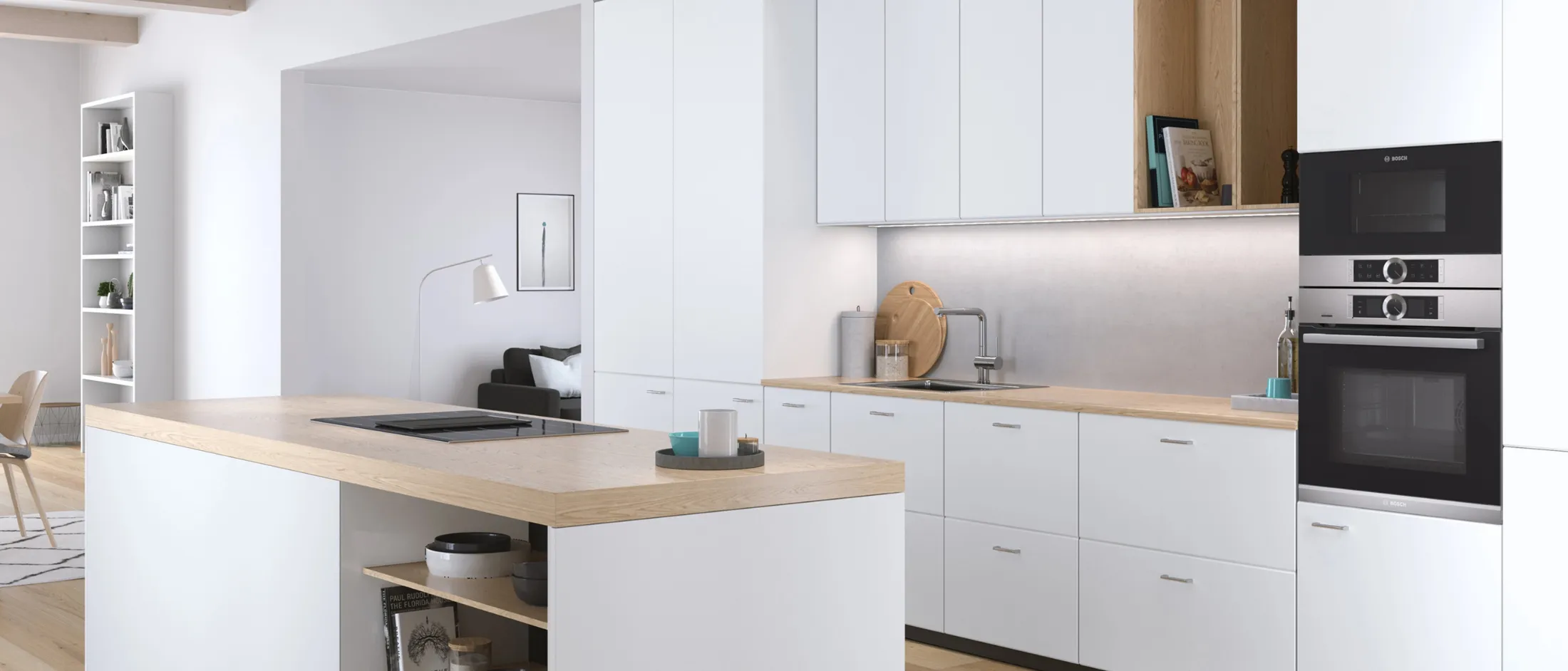 Built-in Bosch microwave seamlessly integrated on top of an oven into a modern white and wood kitchen design.