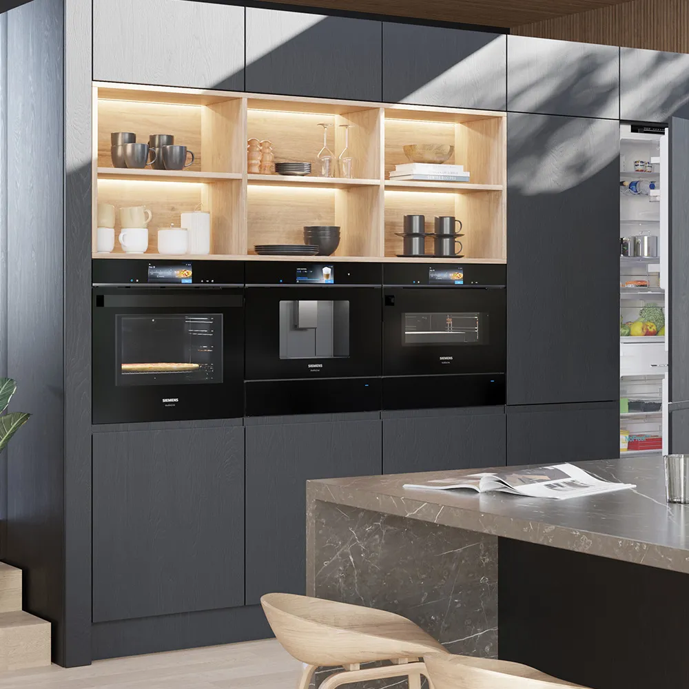 Modern Siemens kitchen with black ovens and integrated fridge.