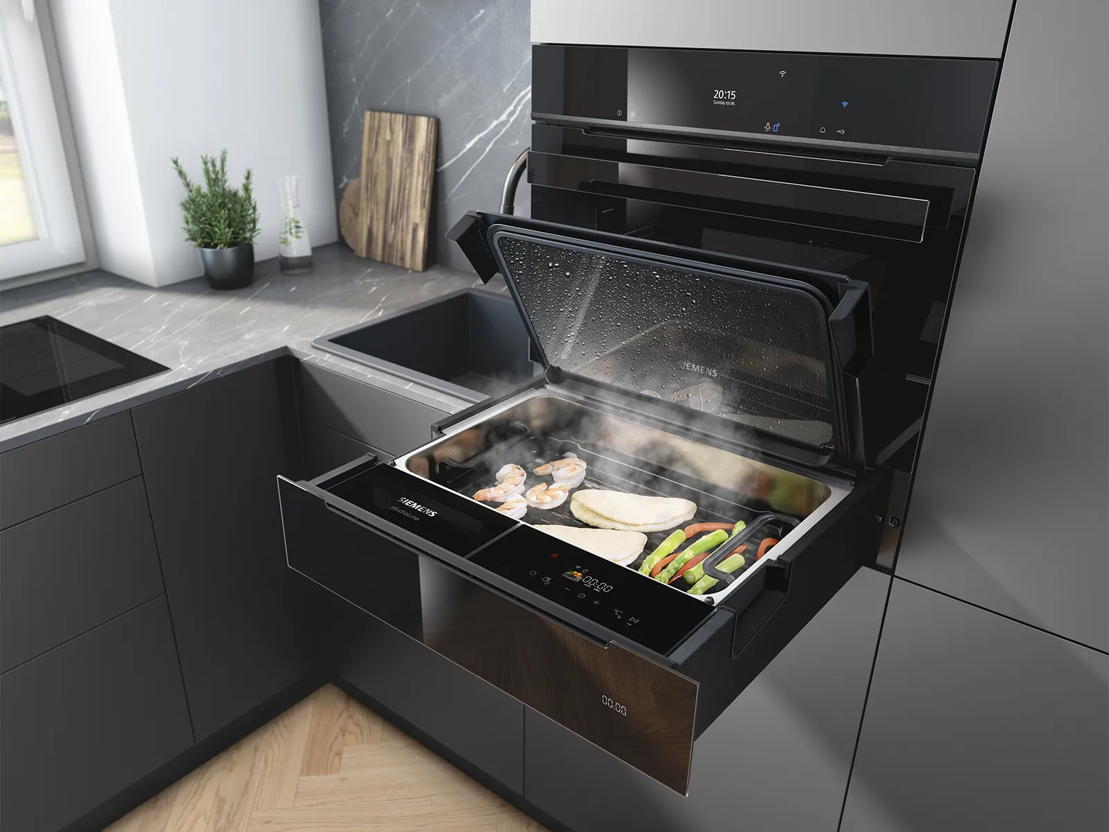 Siemens steam drawer with an open lid, cooking shrimp, vegetables, and bread inside a modern kitchen.