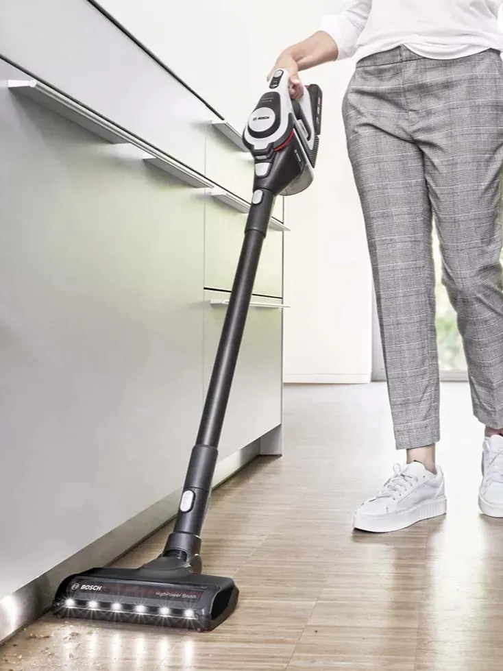 Person using Unlimited 10 vacuum