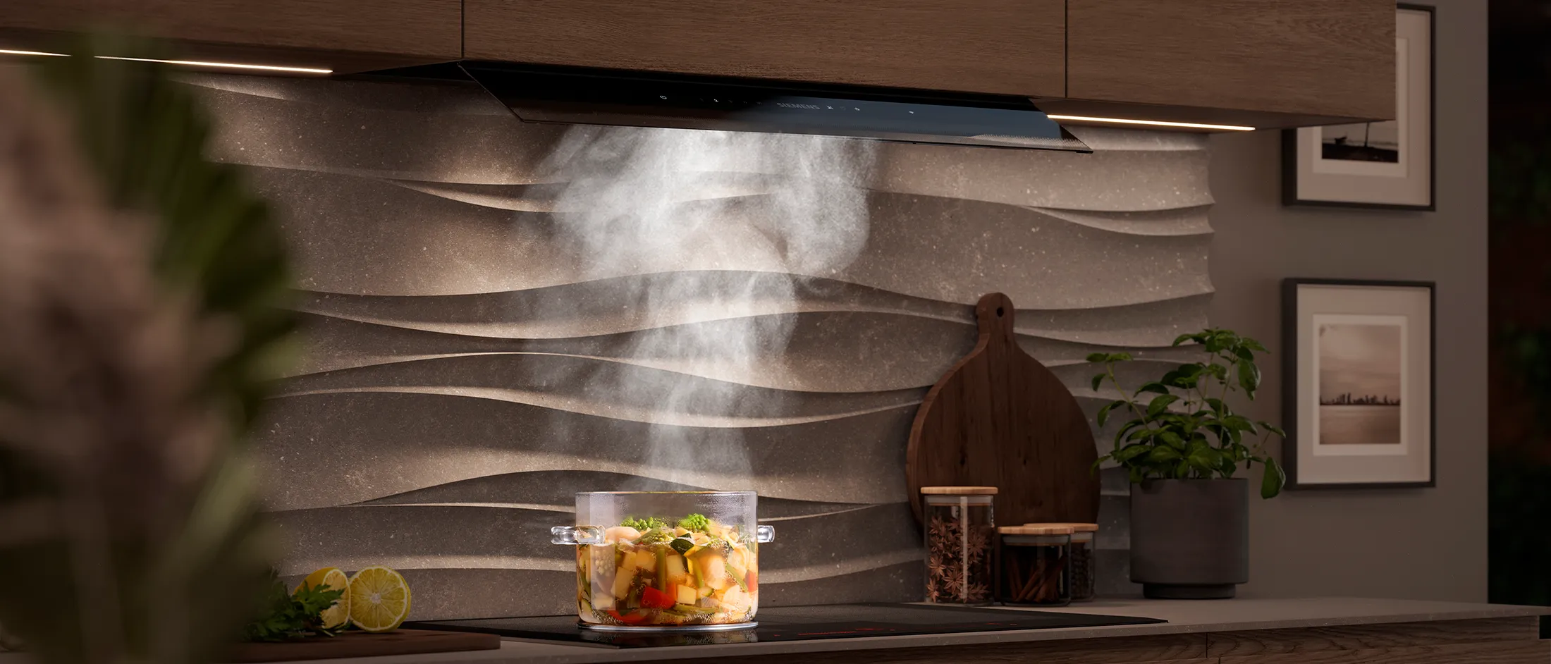 Modern kitchen with wood cabinets, textured backsplash, cooking pot steaming on the stove below a hood.