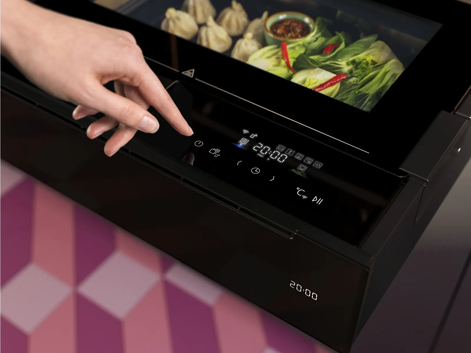 A hand touching the control panel of a black drawer, with a digital display showing settings and food being prepared inside.