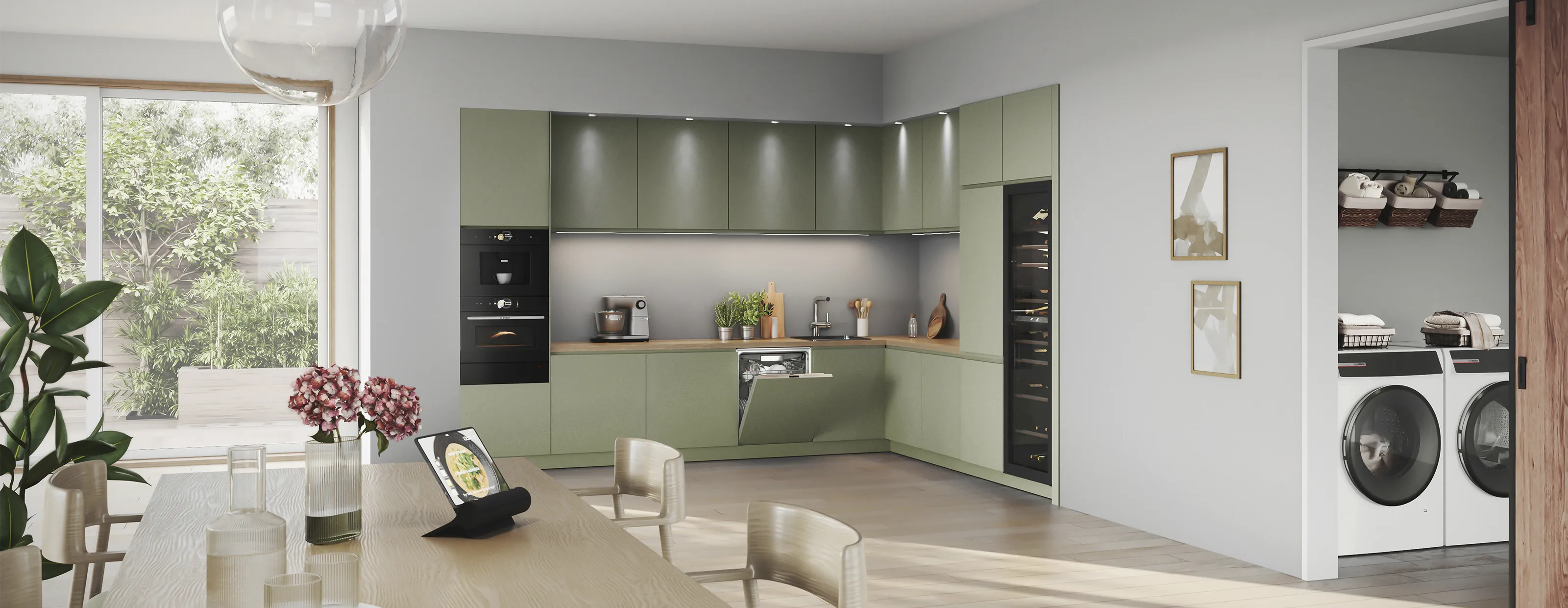 Camera luminosa e minimalista con icona MyBosch app a parete, tavolo in legno con piatti e opere d'arte incorniciate.