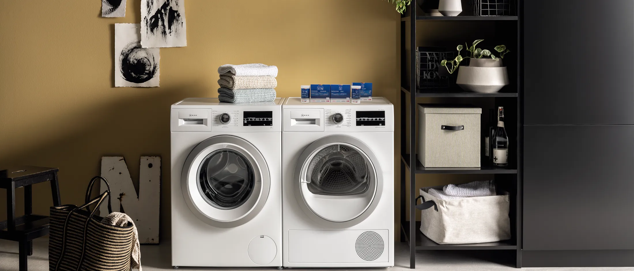 A kitchen featuring a washing machine beside a sink, showcasing a functional and practical home environment.