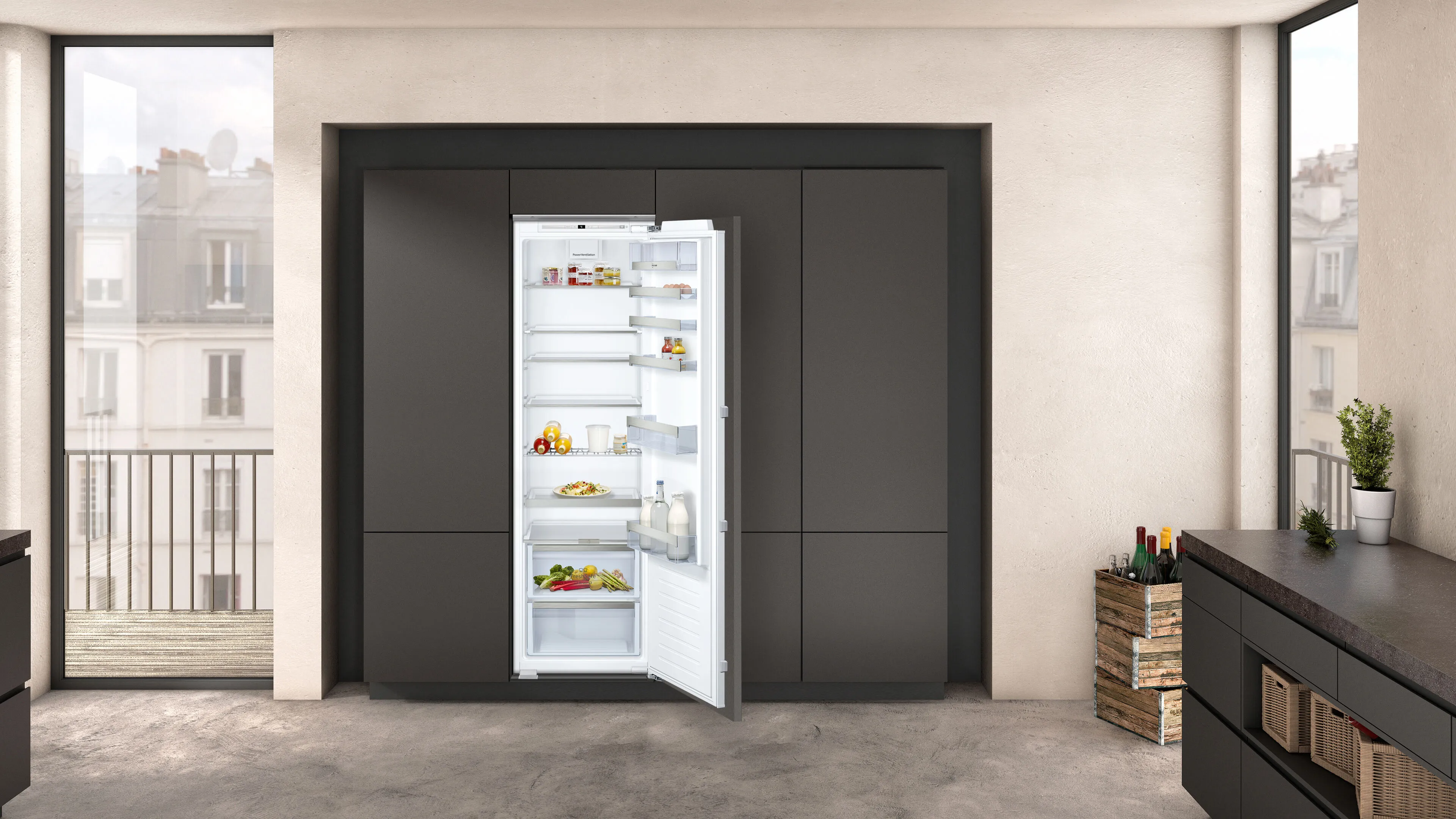 A built-in open fridge-freezer combination to the right of a large window.