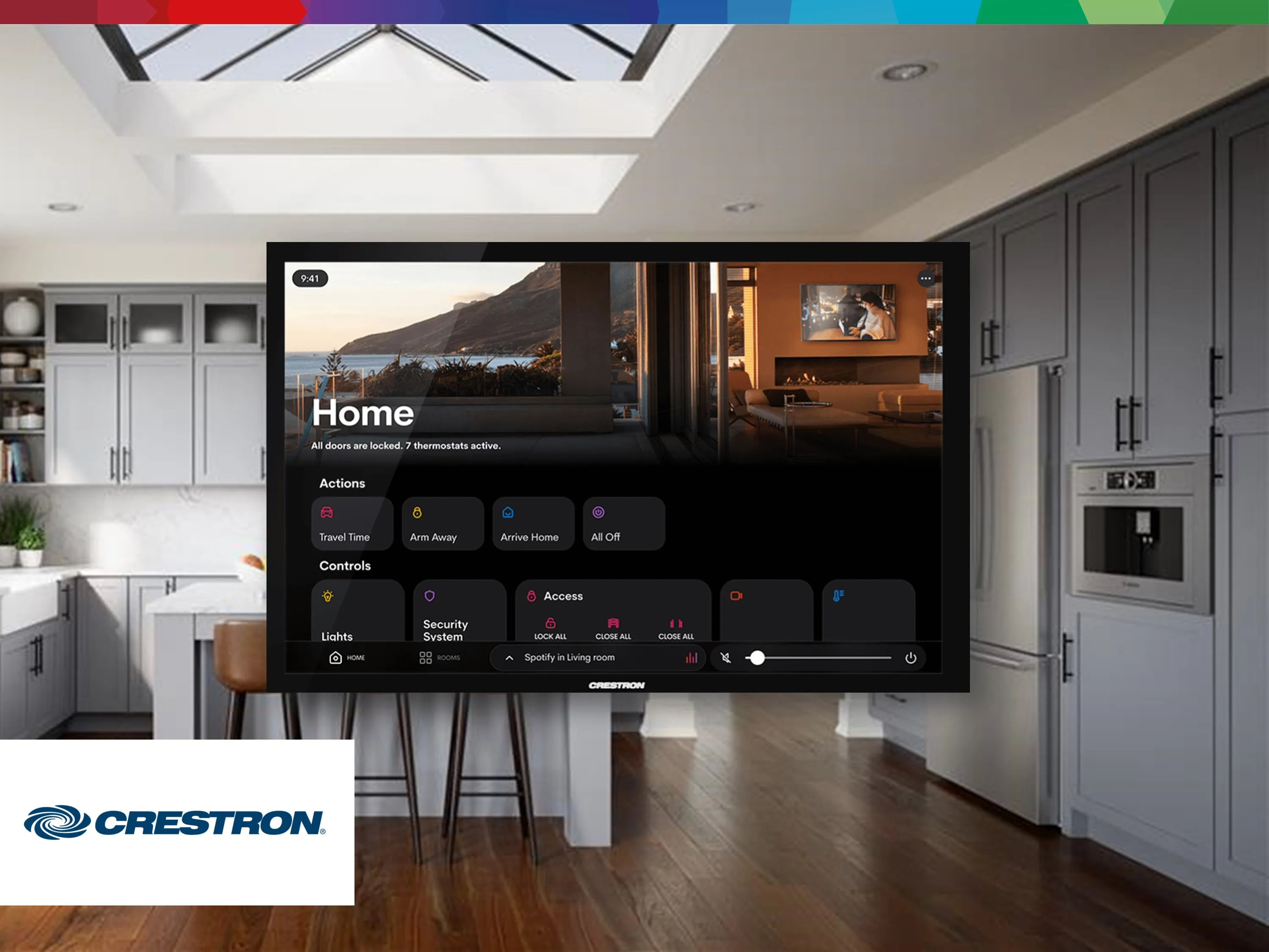 A modern kitchen with a Crestron smart display showing home automation controls on the screen.