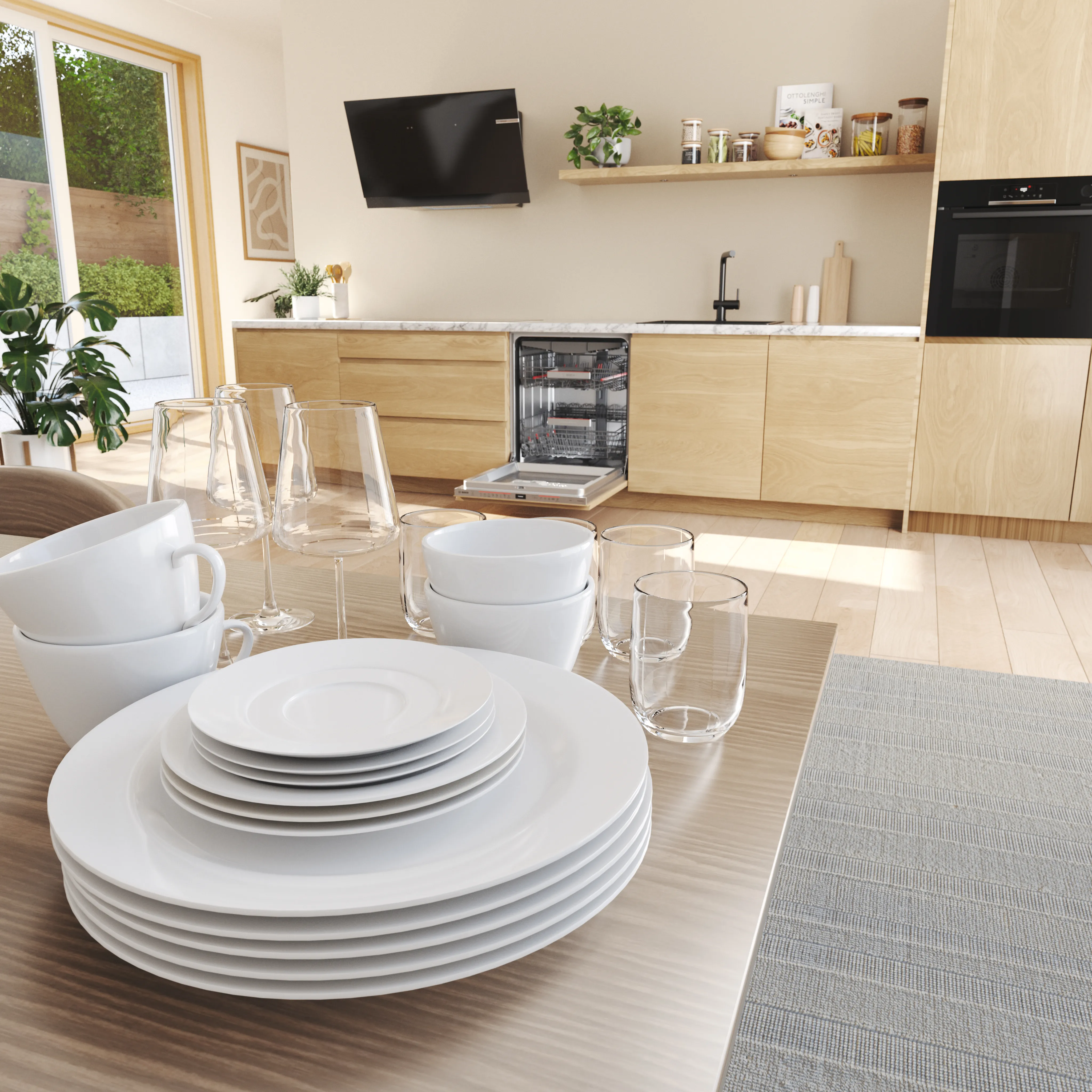Cucina moderna e luminosa con una lavastoviglie Bosch aperta e delle stoviglie in vetro e ceramica su un tavolo: bicchieri, piatti e tazze.