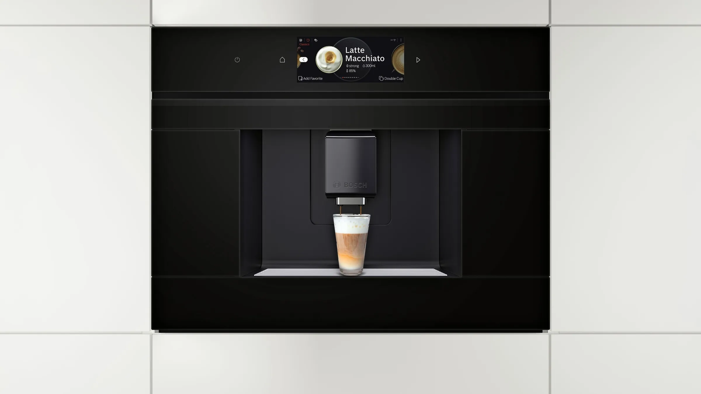 Built-in coffee machine next to built-in oven in a white interior kitchen.