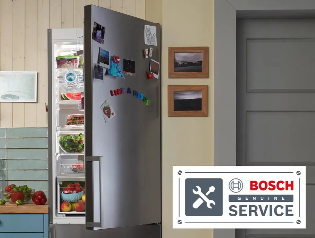 Bosch Fridge freezer in kitchen interior, with opened door and service center logo in the front of the photo 