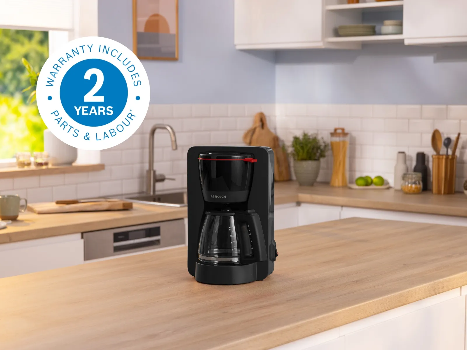 Bosch coffee machine on kitchen counter with 2 year warranty badge
