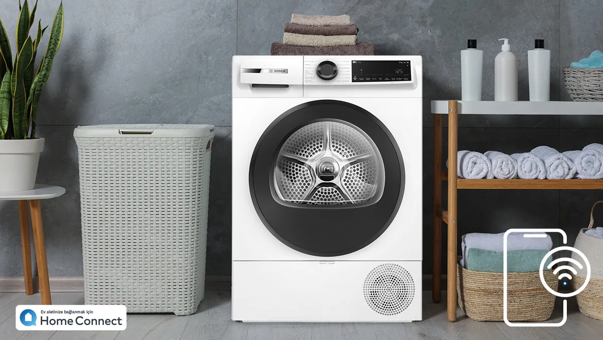 Siyah kapaklı beyaz Bosch Home Connect kurutma makinesi.