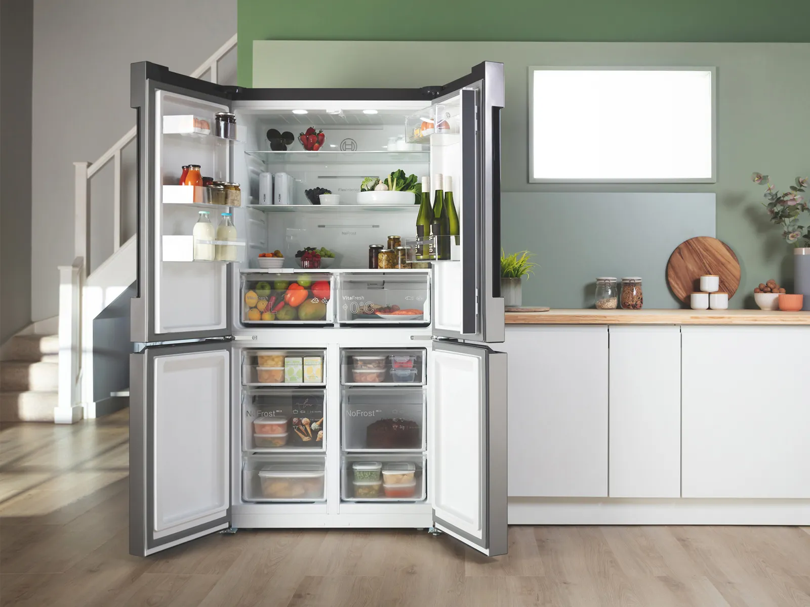Freestanding fridge freezer in the light kitchen design
