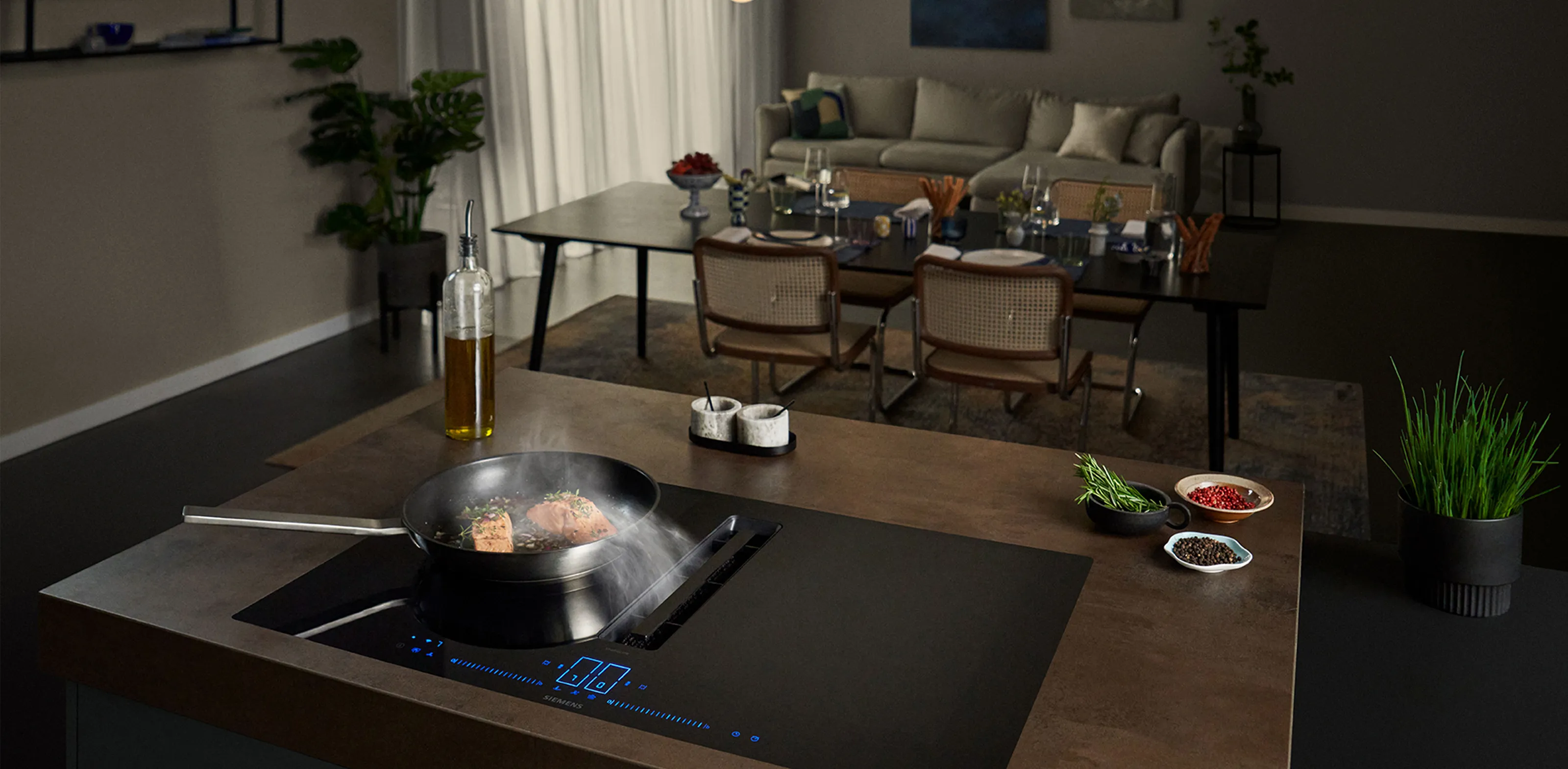 A kitchen featuring a stove and a dining table, showcasing a functional cooking and eating space.
