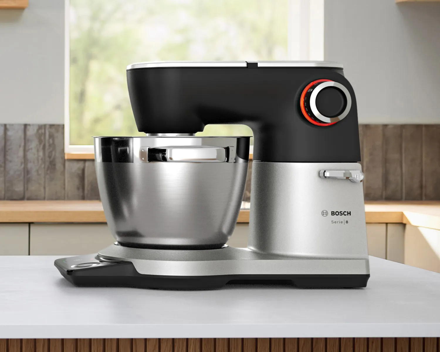 A side shot of stand mixer Series 8 with full metal housing on a kitchen counter.