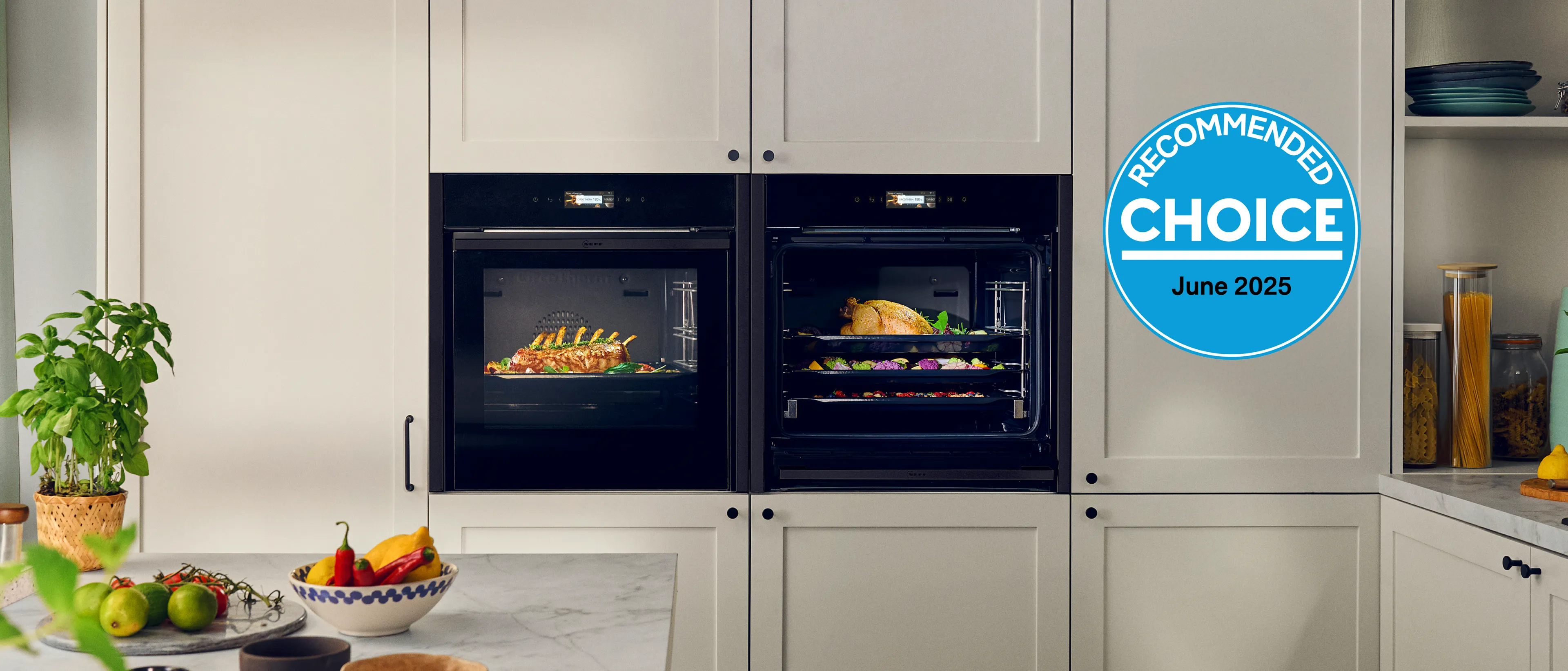 Two NEFF ovens in a kitchen with food cooking