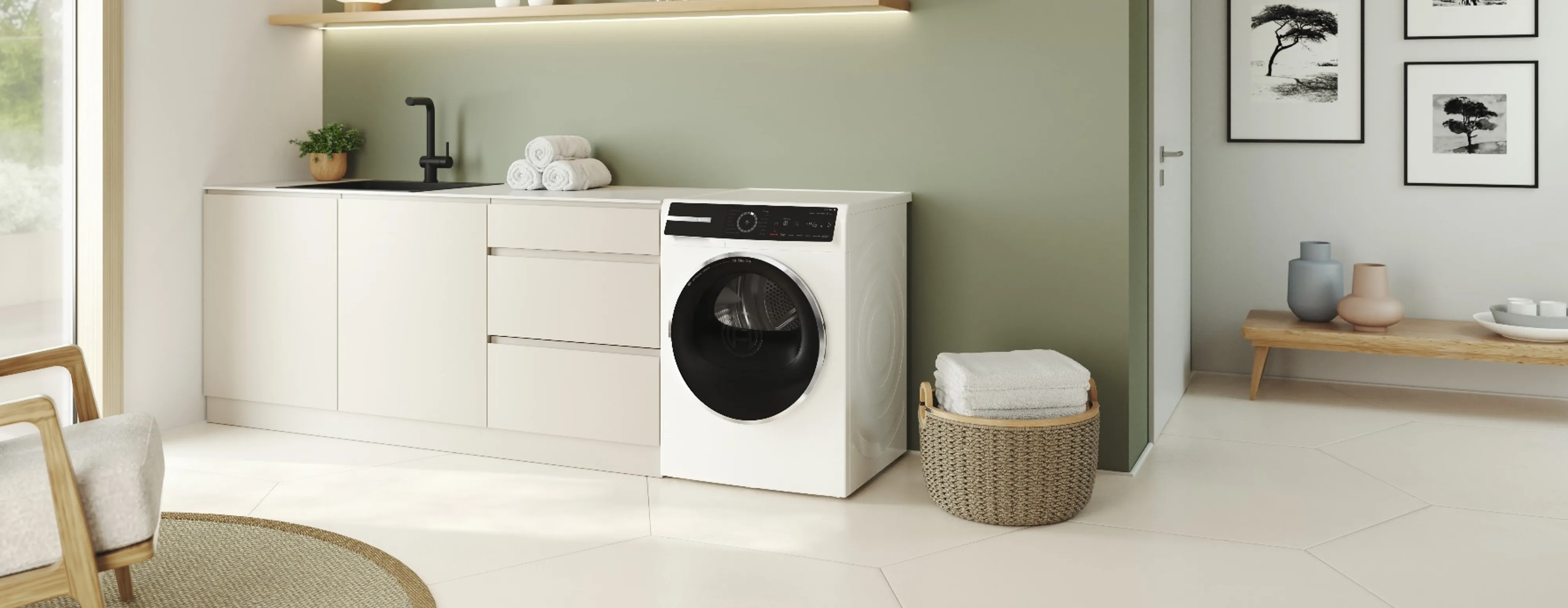 Bosch washer and dryer in a white laundry room.