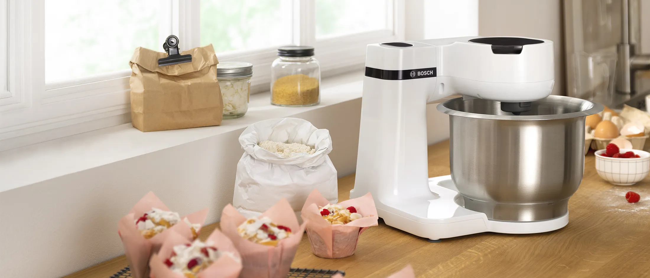 Side view of white Series 2, surrounded by baked goods.